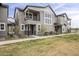 Attractive exterior of a two-story townhome with balcony and modern architectural details at 11300 N Casa Dega Dr # 1020, Surprise, AZ 85388
