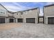 Multi-unit home exterior with garages and well-maintained landscaping at 11300 N Casa Dega Dr # 1020, Surprise, AZ 85388