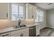 Modern kitchen with stainless steel appliances, sleek cabinets, and a view outside at 11300 N Casa Dega Dr # 1020, Surprise, AZ 85388