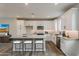 Modern kitchen featuring white cabinets, stainless steel appliances, and a central island at 11300 N Casa Dega Dr # 1020, Surprise, AZ 85388