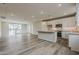 Spacious open concept with modern kitchen, island, and living area at 11300 N Casa Dega Dr # 1020, Surprise, AZ 85388