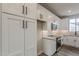 Bright, modern kitchen with white cabinets and stainless steel appliances at 11300 N Casa Dega Dr # 1020, Surprise, AZ 85388
