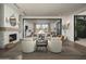 Inviting lounge area with cozy seating around a fireplace, offering a relaxing and elegant ambiance at 11300 N Casa Dega Dr # 1020, Surprise, AZ 85388