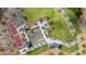 Aerial view showcases the community park featuring multiple amenities including a tennis court and firepit at 12047 E Sereno Rd, Gold Canyon, AZ 85118