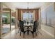 Comfortable dining room with a sliding glass door, chandelier, and access to outdoor living at 12047 E Sereno Rd, Gold Canyon, AZ 85118