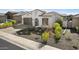 Wide angle shot of a quaint single-story home with desert landscaping and a tiled roof at 12047 E Sereno Rd, Gold Canyon, AZ 85118