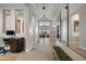 Bright and inviting foyer featuring a desk, mirror, and tiled floors leading into the home at 12047 E Sereno Rd, Gold Canyon, AZ 85118