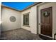 Inviting entryway featuring a decorative wreath on a dark wood door and textured walls at 12047 E Sereno Rd, Gold Canyon, AZ 85118
