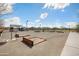 Community horseshoe pit features desert landscaping and lighting at 12047 E Sereno Rd, Gold Canyon, AZ 85118