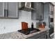 Gourmet kitchen features granite countertops, gray cabinets, stainless steel appliances, and subway tile backsplash at 12047 E Sereno Rd, Gold Canyon, AZ 85118