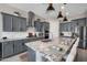 This kitchen boasts granite countertops, an island with seating, and stainless steel appliances at 12047 E Sereno Rd, Gold Canyon, AZ 85118