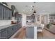 Open-concept kitchen with an island, granite countertops, stainless steel appliances, and easy access to the living area at 12047 E Sereno Rd, Gold Canyon, AZ 85118