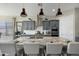 Large kitchen island with seating, granite countertops, stainless steel appliances, and pendant lighting at 12047 E Sereno Rd, Gold Canyon, AZ 85118