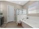 Bright and spacious main bathroom with a walk-in shower, soaking tub, and stylish vanity at 12047 E Sereno Rd, Gold Canyon, AZ 85118