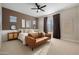 Relaxing main bedroom features stylish decor, accent wall, and a comfortable seating area at 12047 E Sereno Rd, Gold Canyon, AZ 85118