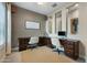 Stylish home office with rich wood desk, modern decor, and natural light at 12047 E Sereno Rd, Gold Canyon, AZ 85118