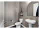 Contemporary powder room with stylish pedestal sink, modern fixtures, and decorative wall accents at 12047 E Sereno Rd, Gold Canyon, AZ 85118