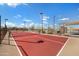 Community tennis court features a shade structure and is surrounded by desert landscaping at 12047 E Sereno Rd, Gold Canyon, AZ 85118