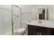 Bathroom featuring a glass shower, single vanity with framed mirror, and toilet at 12324 W Northview Ave, Glendale, AZ 85307