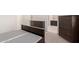 Bed with wooden furnishings in an open floor plan at 12324 W Northview Ave, Glendale, AZ 85307