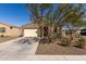 Charming single story home features a desert landscape, neutral tones, and a two car garage at 12324 W Northview Ave, Glendale, AZ 85307