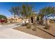 Charming single-story home boasts a well-maintained front yard with desert landscaping and attached two-car garage at 12324 W Northview Ave, Glendale, AZ 85307