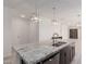 Spacious kitchen island featuring granite countertops and stainless steel sink at 12324 W Northview Ave, Glendale, AZ 85307