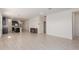 Expansive open-concept living area showcases tile flooring, an open layout, and seamless flow to the kitchen at 12324 W Northview Ave, Glendale, AZ 85307