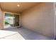 Covered patio with concrete flooring and a sliding glass door leading inside at 12324 W Northview Ave, Glendale, AZ 85307