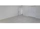 Bright, carpeted bedroom with closet and neutral paint throughout at 1455 N Alma School Rd # 38, Mesa, AZ 85201
