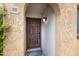 Inviting entryway with a covered archway and a secure, solid wood door at 1455 N Alma School Rd # 38, Mesa, AZ 85201
