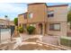 Well-maintained condo exterior with neutral tones, landscaping, and proximity to the community pool at 1455 N Alma School Rd # 38, Mesa, AZ 85201