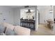 Stylish open-concept living space connected to the kitchen with barstool seating at 1455 N Alma School Rd # 38, Mesa, AZ 85201