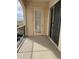 Outdoor balcony with a railing and sliding glass door, offering a private outdoor space at 14575 W Mountain View Blvd # 11313, Surprise, AZ 85374