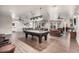 Community room with a pool table, lounge area, and a communal kitchen space at 14575 W Mountain View Blvd # 11313, Surprise, AZ 85374