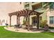 Outdoor picnic area with a pergola, grill, and seating for outdoor dining at 14575 W Mountain View Blvd # 11313, Surprise, AZ 85374