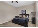 Bedroom with comfortable bed, a large window and cozy carpeted floors at 1473 W Flamingo Dr, Chandler, AZ 85286