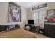 Cozy bedroom with a comfortable bed, workspace, and a poster on the wall at 1473 W Flamingo Dr, Chandler, AZ 85286