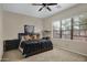 Bedroom with comfortable bed, a large window and cozy carpeted floors at 1473 W Flamingo Dr, Chandler, AZ 85286