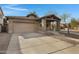 Beautiful single-story home with a cozy front porch, two-car garage, and low maintenance desert landscaping at 1473 W Flamingo Dr, Chandler, AZ 85286