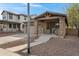 Inviting single-Gathering home featuring a covered porch with stone pillars, a two-car garage, and desert landscaping at 1473 W Flamingo Dr, Chandler, AZ 85286