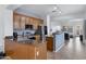 Modern kitchen featuring granite countertops, stainless steel appliances, and seamless flow into dining area at 1473 W Flamingo Dr, Chandler, AZ 85286