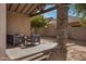 Inviting covered patio area with comfortable seating, offering an ideal spot for outdoor relaxation at 1473 W Flamingo Dr, Chandler, AZ 85286