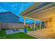 Inviting backyard patio features a stylish pergola, lush artificial turf, and desert landscaping, creating a serene outdoor space at 15290 W Ventura St, Surprise, AZ 85379
