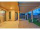 Backyard patio with an open layout includes pavers, a covered pergola, and lush landscaping for exceptional outdoor living at 15290 W Ventura St, Surprise, AZ 85379