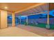 Backyard featuring a covered pergola, decorative landscaping, pavers and luscious artificial turf, perfect for outdoor living at 15290 W Ventura St, Surprise, AZ 85379