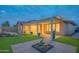 Backyard with a covered patio, artificial turf, and desert landscaping at 15290 W Ventura St, Surprise, AZ 85379