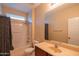 Bathroom featuring a shower/tub combo and a single sink vanity at 15290 W Ventura St, Surprise, AZ 85379
