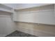 Walk-in closet features multiple shelves and clothing rods, providing ample storage at 15290 W Ventura St, Surprise, AZ 85379