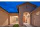 Inviting entryway with a charming front door, neutral colors, and desert landscaping at 15290 W Ventura St, Surprise, AZ 85379